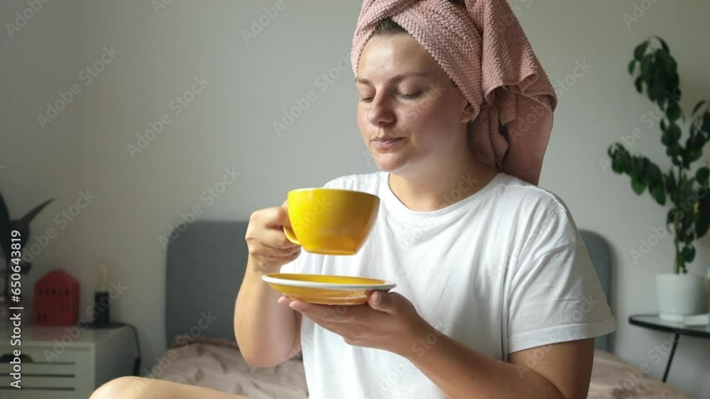 Beautiful relaxed woman, thinking and drinking coffee in bed to relax in morning with a smile and comfort. Female person in a bedroom with a tea cup for wake up, happy memory and wellness in an Beautiful relaxed woman, thinking and drinking coffee in bed to relax in morning with a smile and comfort. Female person in a bedroom with a tea cup for wake up, happy memory and wellness in an