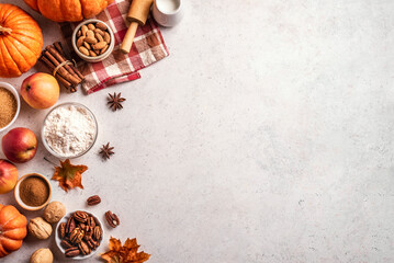 Autumn baking background with pumpkins, apples and nuts