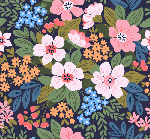 Beautiful floral pattern in small flowers. Delicate white flowers and lilac leaves. Light pink background. Liberty print. Floral seamless background. Trendy template for fashion prints. Stock pattern.