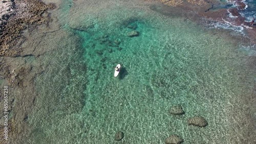 An aerial view of Achziv beach in Israel with a man on a SAP drone view from Israel photo