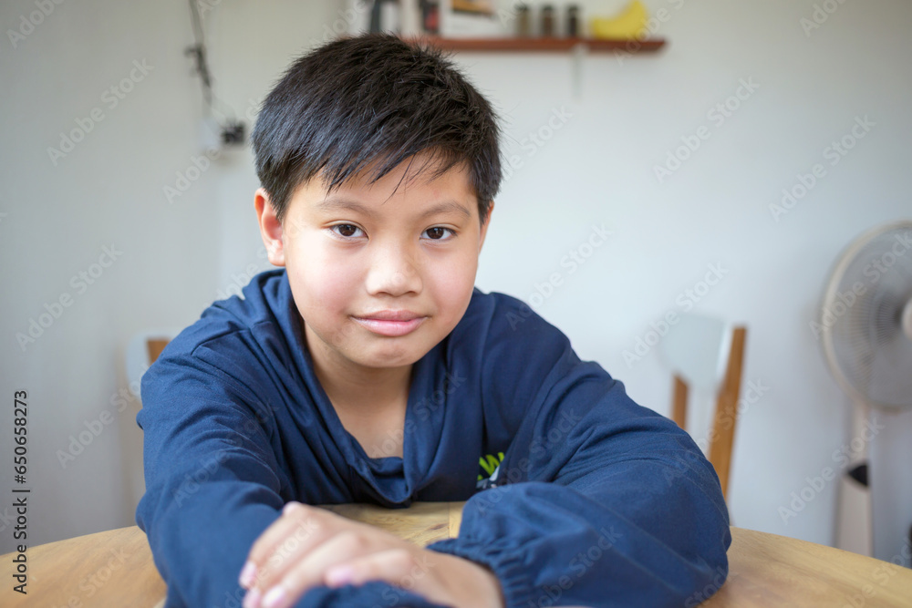 Cute Asian kids boy with white skin smiling and looking into the camera happy. Close-up portrait of a cute Asian thai kids boy Cute Asian kids boy with white skin smiling and looking into the camera happy. Close-up portrait of a cute Asian thai kids boy