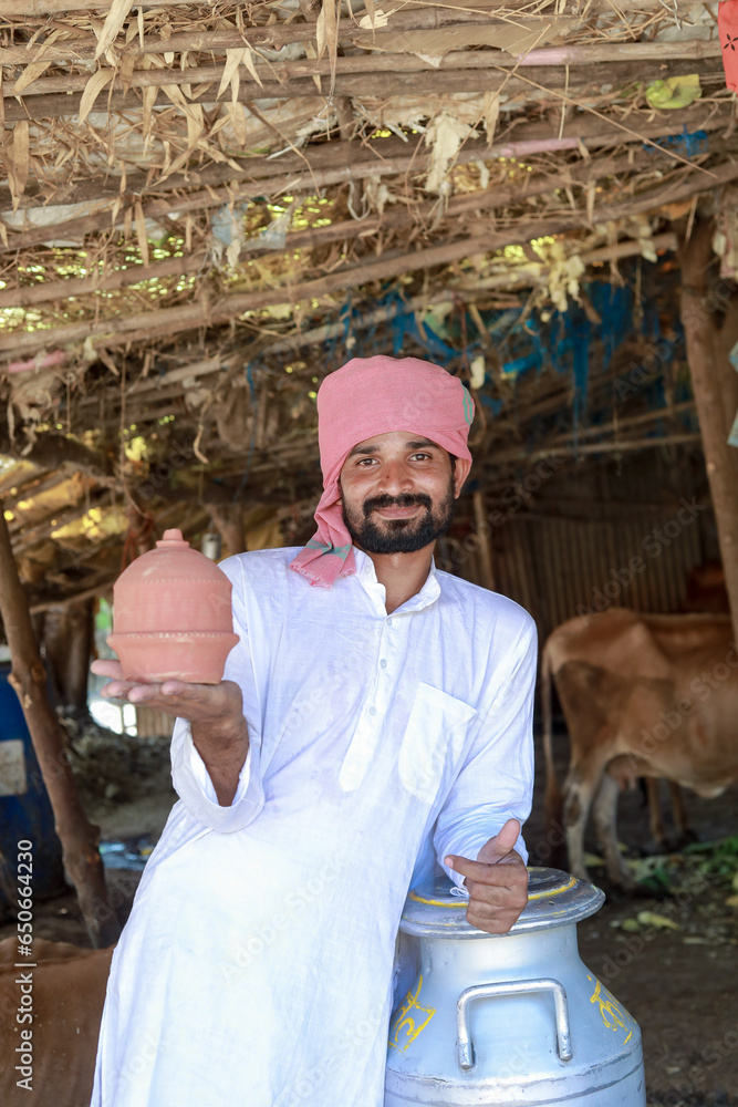 happy Indian farmer selling milk
