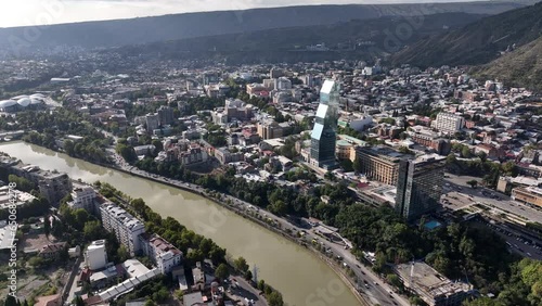 bilisi, Georgia - July 13 2023: Flying over Shota Rustaveli avenue in the center of city. Aerial view of The Biltmore Tbilisi Hotel photo