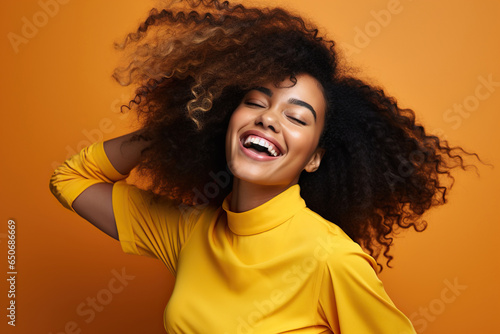 Young, fashionable black woman celebrates and enjoys herself © wolfhound911