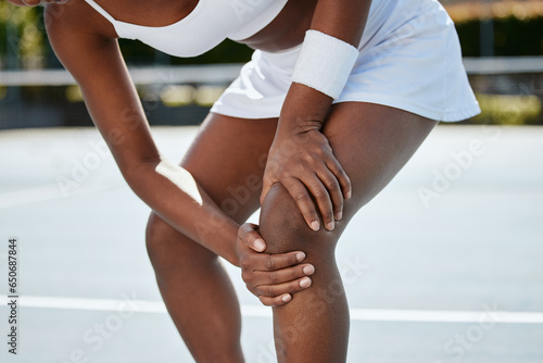 Sports, tennis court and woman with legs injury, medical crisis or first aid emergency, cardio crisis or knee joint pain. Tired player, athlete or bad workout accident from anatomy training challenge