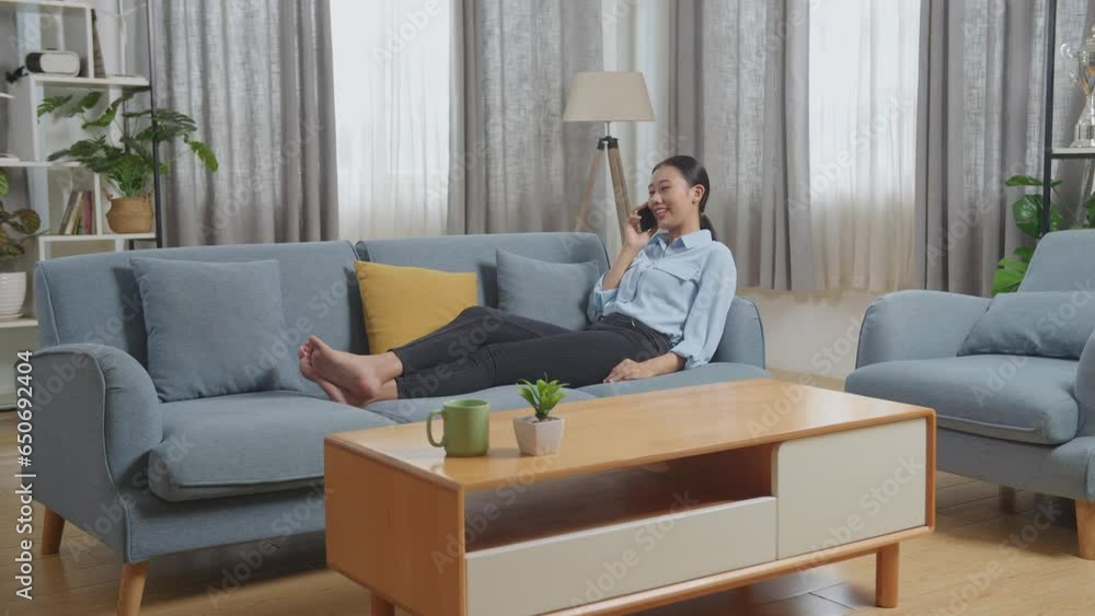 Full Body Of Asian Woman Talking On Smartphone While Lying On Sofa In The Living Room
Full Body Of Asian Woman Talking On Smartphone While Lying On Sofa In The Living Room