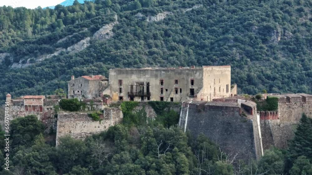 Aerial sweep of Amélie-les-Bains' historic fort standing tall.
Aerial sweep of Amélie-les-Bains' historic fort standing tall.