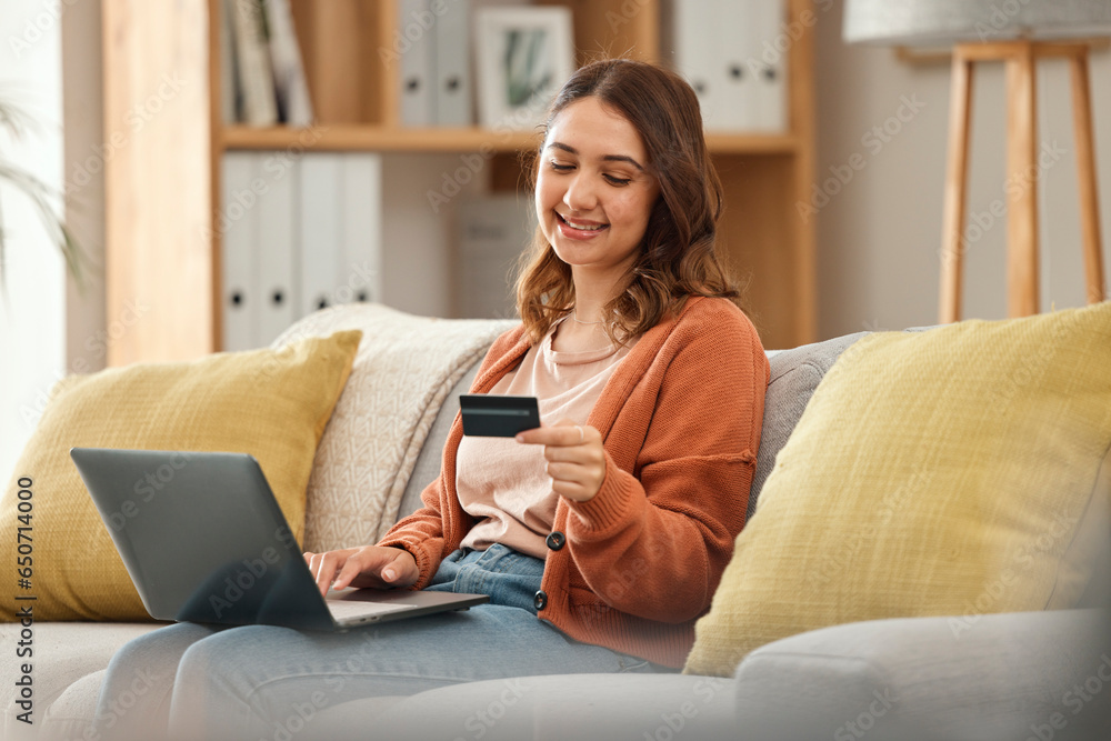 Laptop, credit card and retail with a woman in her home for bank payment or accounting. Computer, finance or budget with a happy young customer in the living room for ecommerce or online shopping Laptop, credit card and retail with a woman in her home for bank payment or accounting. Computer, finance or budget with a happy young customer in the living room for ecommerce or online shopping