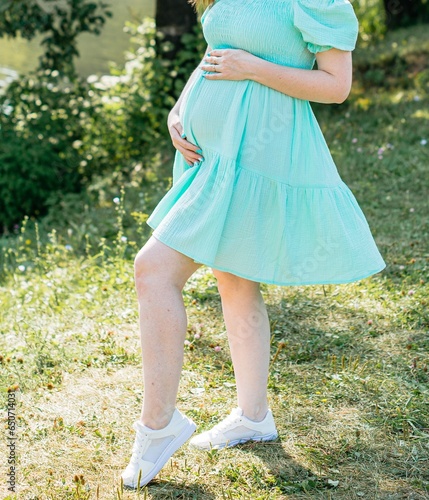 woman in a dress walking in the park