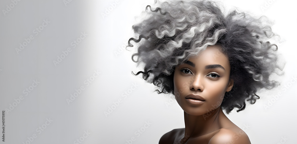 Beautiful African American woman portrait isolated on light grey background