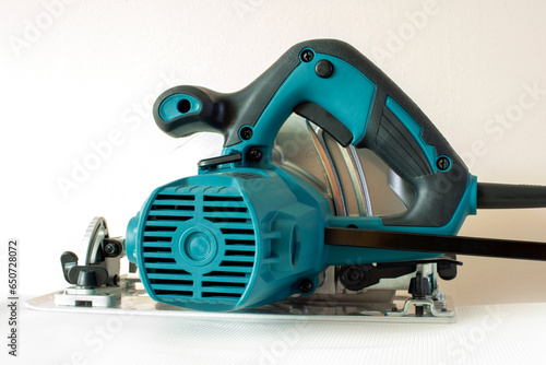 New modern circular saw on a white background. Disc circular saw.