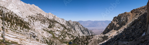 Panorama view of mountain valley with conifers and lake with white rocks around in Mount Whitney in usa © AllThings