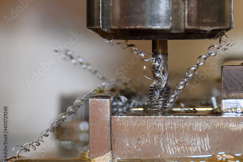 Close up scene the thread making process on metal plate. photo