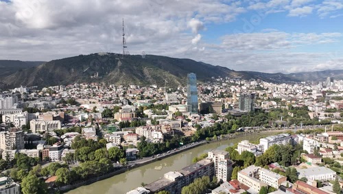 Tbilisi, Georgia - July 13 2023: Flying over Shota Rustaveli avenue in the center of city. Aerial view of The Biltmore Tbilisi Hotel photo