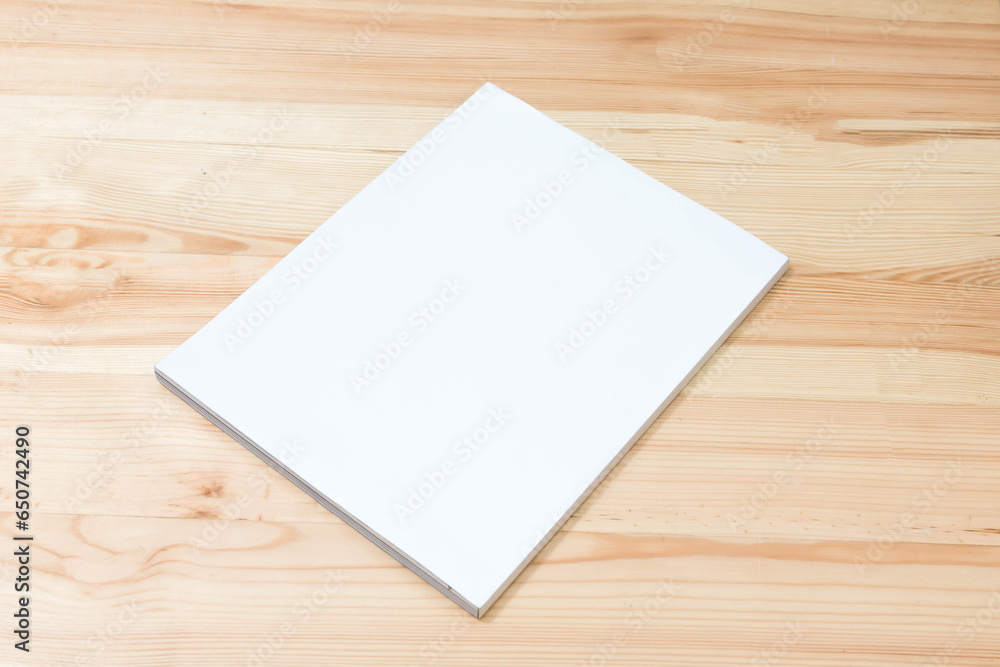 Mockup of blank book cover white on textured wooden background.
Empty magazine template to your design.
top view. Mockup of blank book cover white on textured wooden background.
Empty magazine template to your design.
top view.
