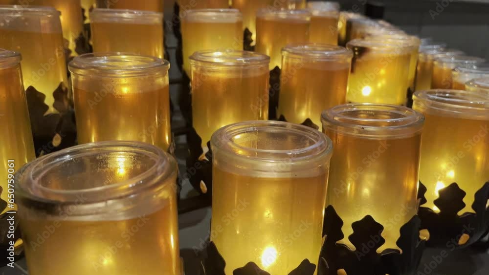 Many candles lit in the sanctuary in Praise of God and the Saints. St