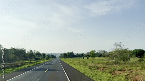 Motorway in Paraguay seen from inside the moving car filmed through the windshield in a rural region. National Road Blas Garay, Paraguay. 2022-10-20 photo