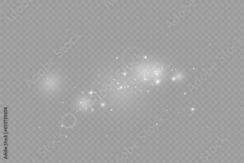 Dust sparks and stars shine with a special light. Christmas light effect. Glittering particles of magic dust.Vector sparkles on a transparent background.