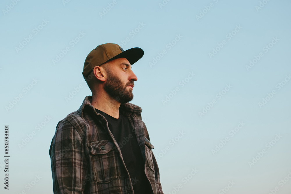 A farmer in a wheat field at sunset. An agronomist inspects a wheat field. The concept of growing a new crop. A farmer in a wheat field at sunset. An agronomist inspects a wheat field. The concept of growing a new crop.