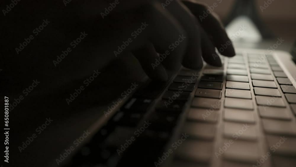 Close up of unrecognizable woman sitting at desk at night typing something on laptop keyboard. High quality FullHD footage Close up of unrecognizable woman sitting at desk at night typing something on laptop keyboard. High quality FullHD footage