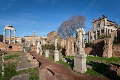 Statues of virgin vestals and ruins of temples on the Roman Forum in Rome, Italy photo