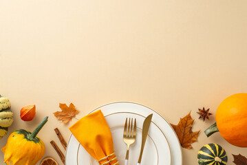 Above view captures essence of family Thanksgiving dinner with gilded tableware, classic cutlery, and autumnal decorations rest on a beige isolated background, inviting text or promotional content