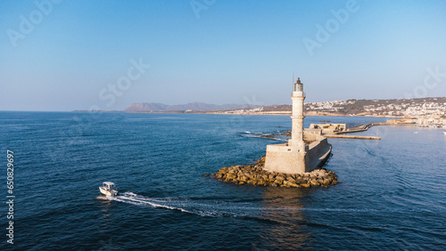 Old lighthouse building at Chania, Greece. Famous travel tourism landmark. Aerial top down drone view.