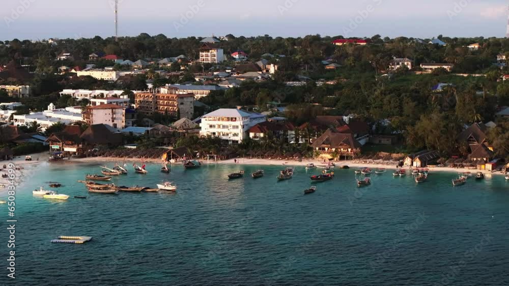 Aerial view of wooden fisherman boats and sandy beach at Kendwa village, Zanzibar,Tanzania shot at 30 fps Aerial view of wooden fisherman boats and sandy beach at Kendwa village, Zanzibar,Tanzania shot at 30 fps