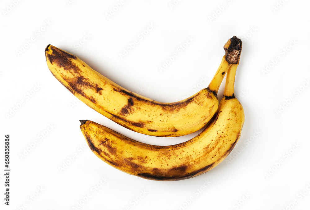 Rotten, overripe bananas isolated on white background. Flat lay. Food waste concept. Rotten, overripe bananas isolated on white background. Flat lay. Food waste concept.
