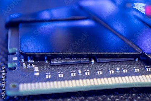 Memory module DDR4 DRAM macro in blue light. Computer RAM chipset close-up. Desktop PC hardware components