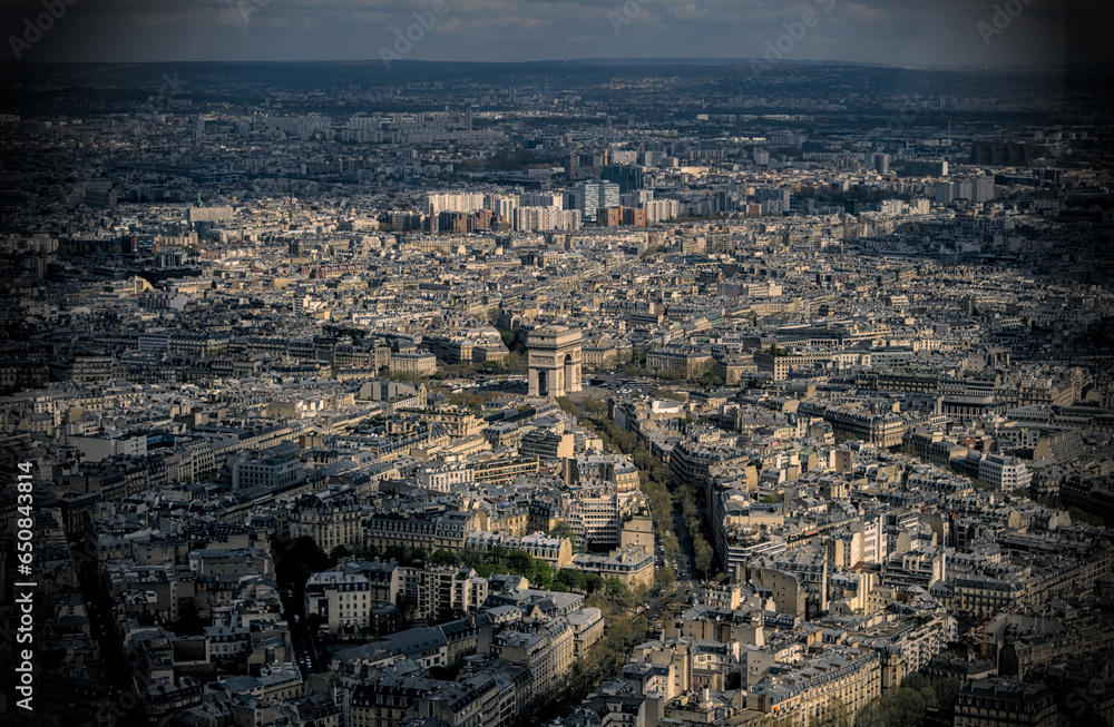 Paris, France - April 3 2019: The arc de triomphe from the eiffel tower over the streets of Paris on a clear day