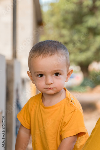 boy looking forward in the field