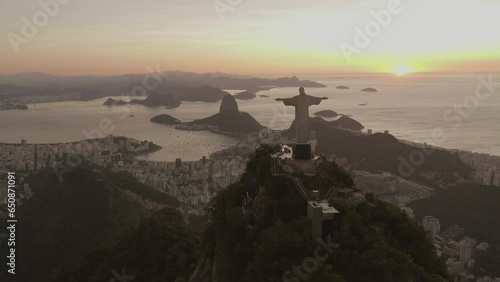 Flying around Christ the Redeemer statue at sunset, World Seven Wonders landmark in Rio de Janeiro, Brazil photo