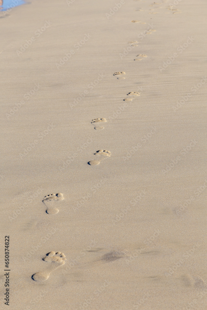 Human footprint on sand summer tropical beach background Human footprint on sand summer tropical beach background
