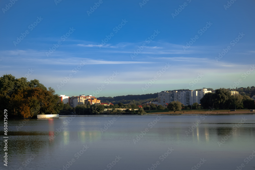 common outskirts poor city view with water surface foreground and island buildings background outdoor