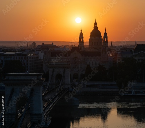 Breathtaking view of the Chain Bridge in Budapest, Hungary, illuminated by the rising sun