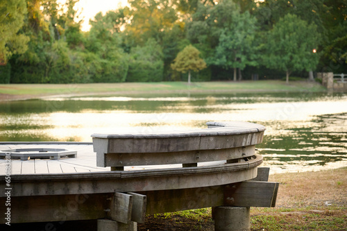 THE WOODLANDS, TEXAS - AUGUST 5th 2023: background settings for outdoor portraits Rob Fleming Park. The lake waters are tranquil, the fall colors are spectacular, there are hidden paths and benches.