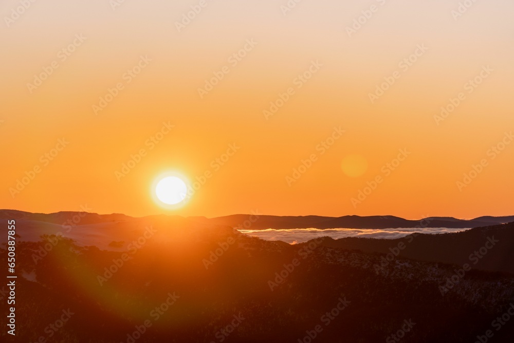 Aerial view of a mountain range at sunset Aerial view of a mountain range at sunset