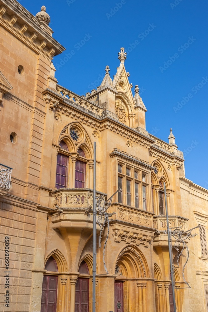 Close-up shot of an exterior wall of a multi-story building in Mdina Old City Fortress