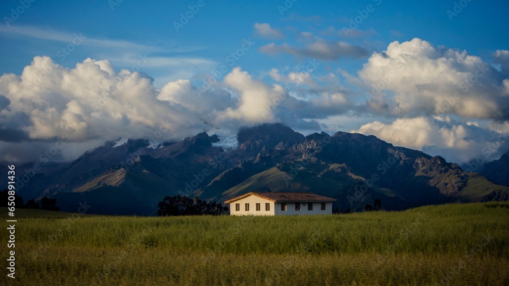 Traditional-style building in a wide open meadow with a unique rural scenery Traditional-style building in a wide open meadow with a unique rural scenery
