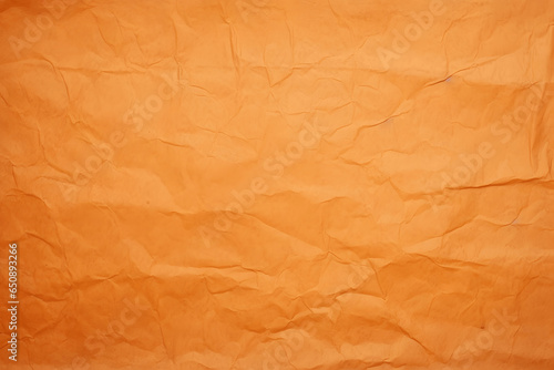 Die Textur von orangenem Papier zerknittert - Hintergrund für verschiedene Zwecke