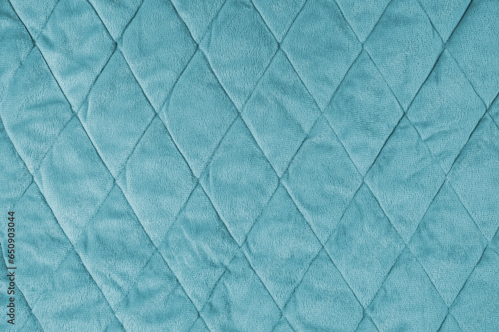 Quilted velours fabric background. Turquoise texture blanket or puffer jacket, stiched with diamond pattern, soft wrinkled surface, crupmed textile - obrazy, fototapety, plakaty 