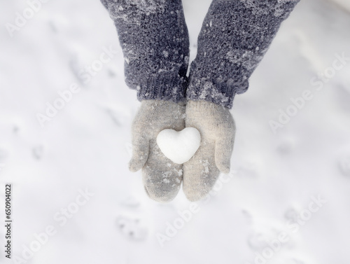 hand grabbing the snow, cold winter