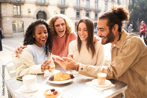  People group talking at coffee bar terrace. Friends having fun together at cafeteria on brunch time. Lifestyle concept with happy men and women at cafe venue. High quality photo
