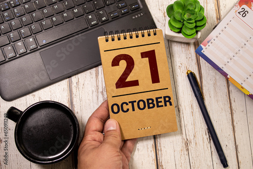 October 21 calendar date text on wooden blocks with copy space for ideas. Copy space and calendar concept.