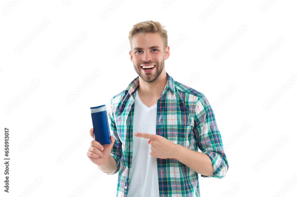 man with haircare cosmetics in studio, pointing finger. photo of man with haircare cosmetics. man with haircare cosmetics in studio, pointing finger. photo of man with haircare cosmetics.