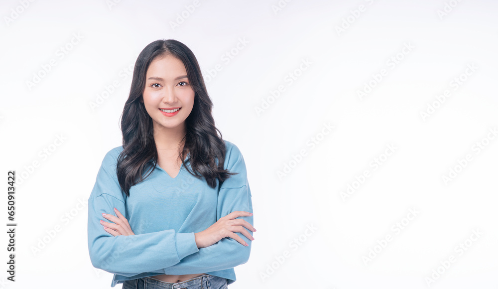 Confident success asian woman standing arms crossed on white background. Positive charming young woman wear casual smiling arms crossed over isolated. Successful occupation lifestyle concept. Confident success asian woman standing arms crossed on white background. Positive charming young woman wear casual smiling arms crossed over isolated. Successful occupation lifestyle concept.