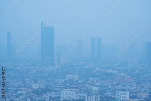 Skyscraper mist bad problem unhealthy toxic pm2.5 weather smog bangkok city in morning. Fog skyline air pollution over building downtown mist quality poor office architecture cityscape view at bangkok photo