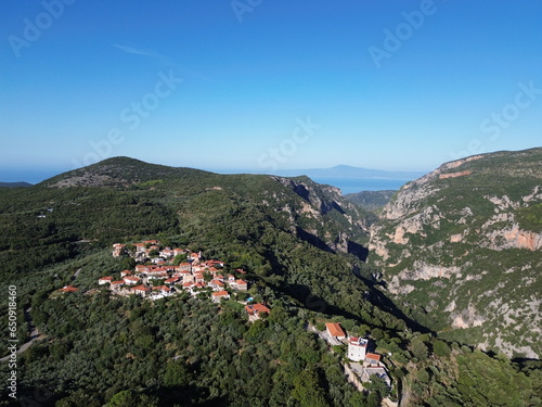 Old traditional stoned buildings and houses in Vorio village located near Kentro Avia and Pigadia Villages in Mani area, Taygetus Mount, Messenia, Greece photo