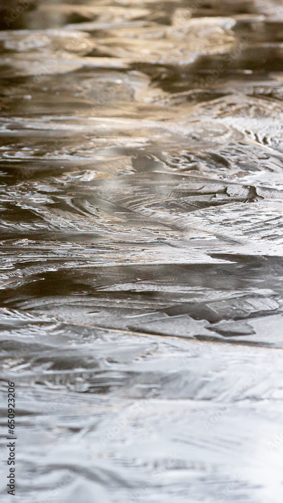 Winter ice on pond in Texas during a frigid storm